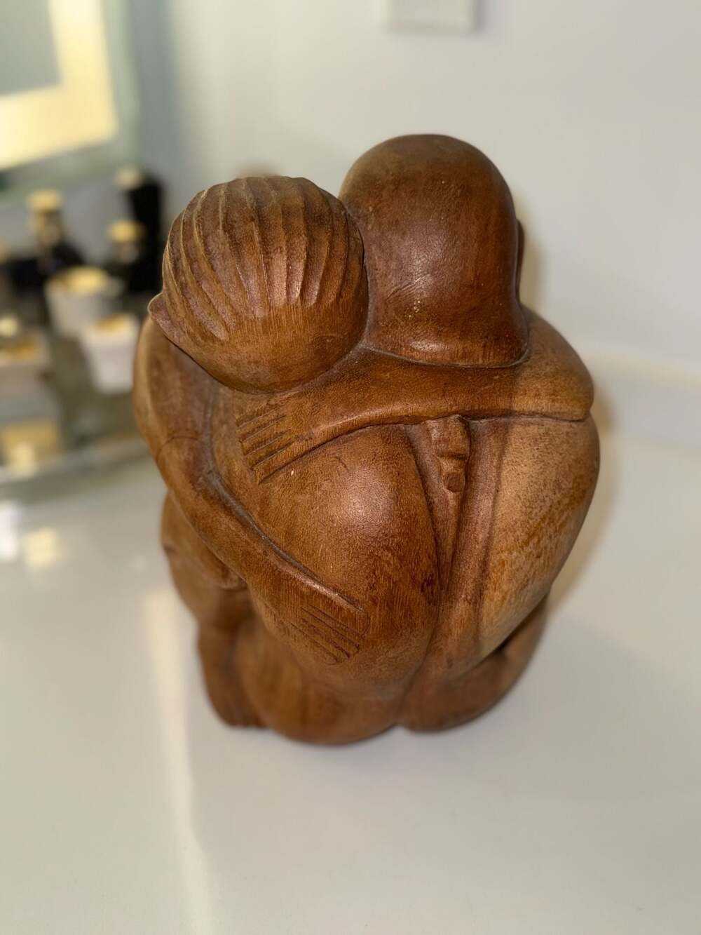 Vintage Hand-Carved Suar Wood Sculpture of Embracing Figures